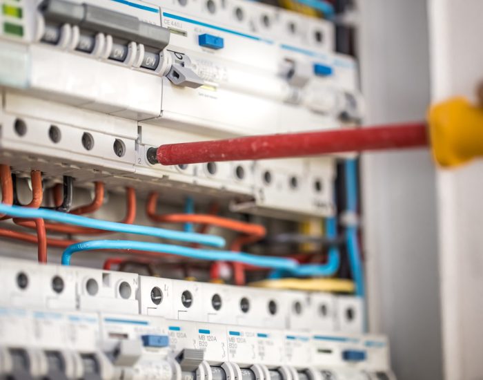 man-electrical-technician-working-switchboard-with-fuses-installation-connection-electrical-equipment-close-up (2) Man, an electrical technician working in a switchboard with fuses. Installation and connection of electrical equipment. Professional with tools in hand. concept of complex work, space for text. SSUCv3H4sIAAAAAAAEAI1Ry27DIBC8V+o/WJxjyQ/iPP6gh0q9Rz2sYR2jYIh4tIqi/HvBhIpT1Rs7s8zu7NxfX6qKjGAFI8fqHqtQCym9dQac0CrAzeaJG1QcTYkgF04bAbIER3BsVrBgAJWXMsKPlSTWgfMWbRz2hBg4PAeNBP5KpI1Oqa4ysZLhR6DIB+qrRLIpGOvHyLwLy1BKUKi9JZl/bP4Qe1M8Wo5O/i+YHp/ZN5xRsdtqrbBsUCIky6fUSi7fDs1SHgE8F7rw/6UZyNjQF0pXI5hQ5+KbdvOaR/7GtFfOxBVItkGk1lcYZQxjCpqY8RmsDe0848UgFk6hl2KO0m418FQlPGQWy7bv2j2lW9q2u363b7qB5Jw1uwheWkzRzyJQ5lbgIm5AcJgAD31X7waKNW06Wo+HaaiDJNvShjX7CcLhHz9BTefhsQIAAA==